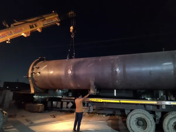 Industrial vessel being handled for transport
