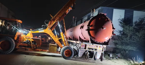 Industrial vessel being loaded at night